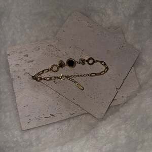 Gold overlay stainless steel bracelet with Roman numerals